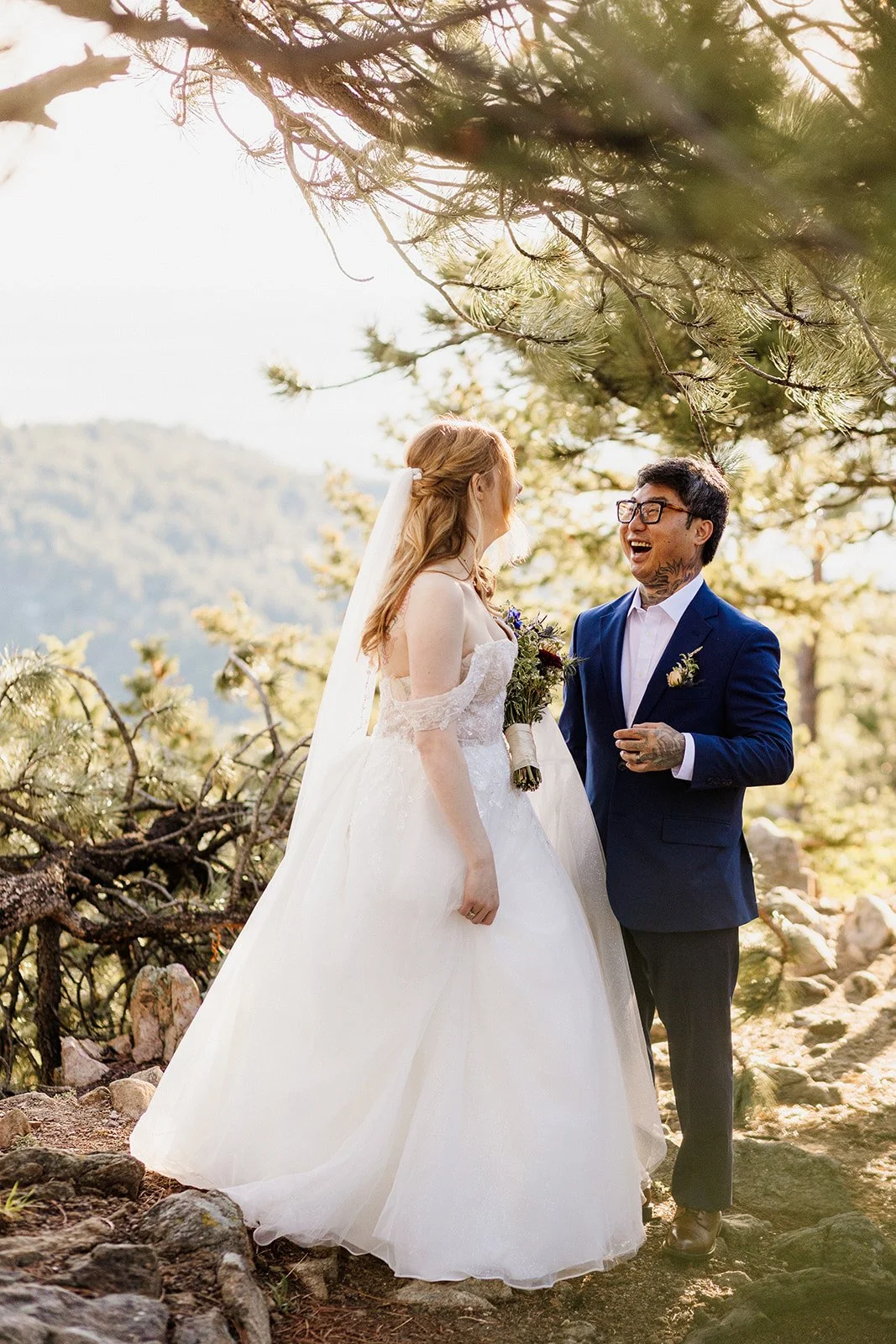 Couple laughing together under the pines at Lost Gulch Overlook