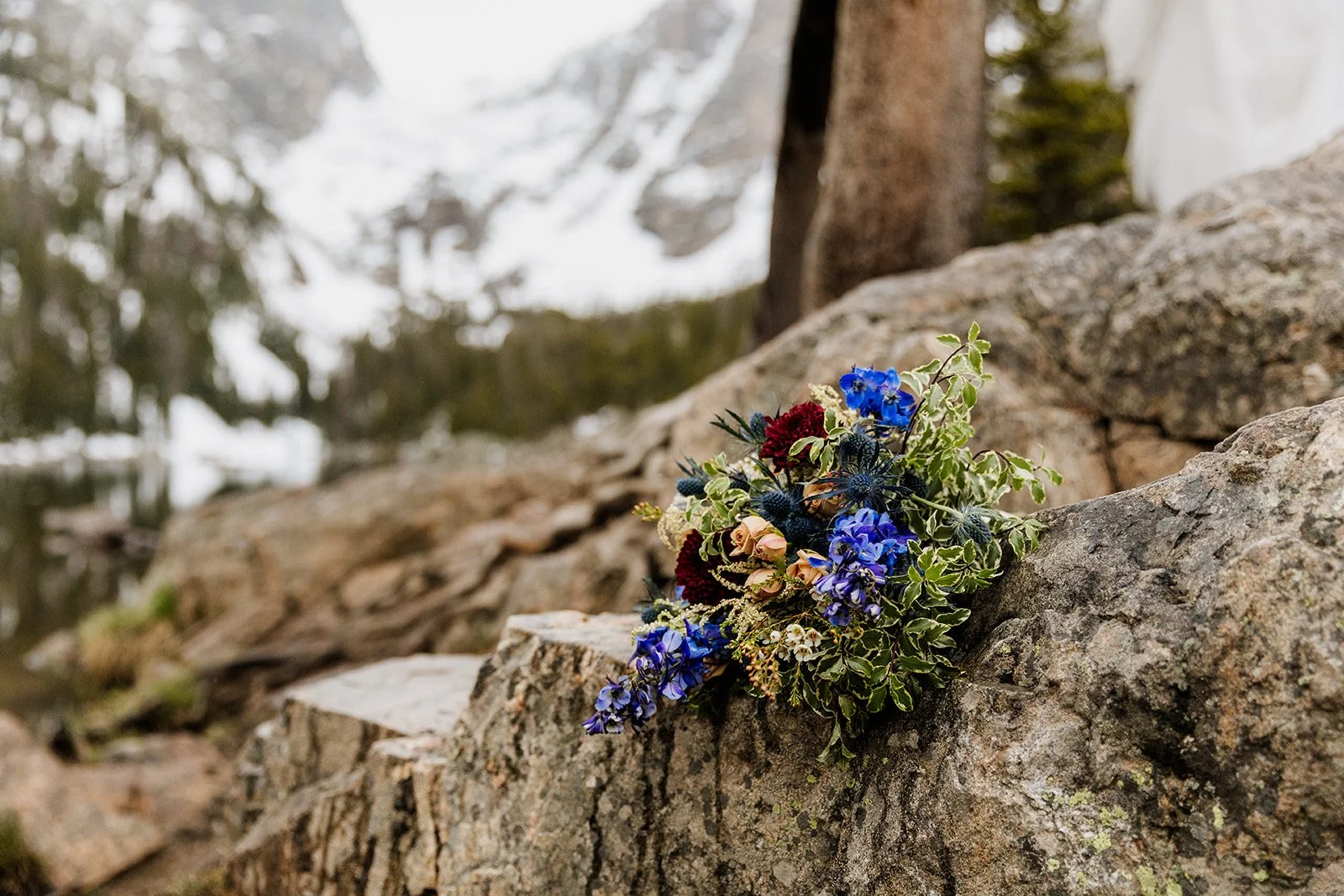 Wedding bouquet resting on a rock at Dream Lake