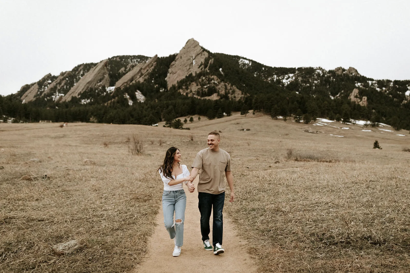 Couple below the Flatirons at Chautauqua Park during a Boulder engagement session