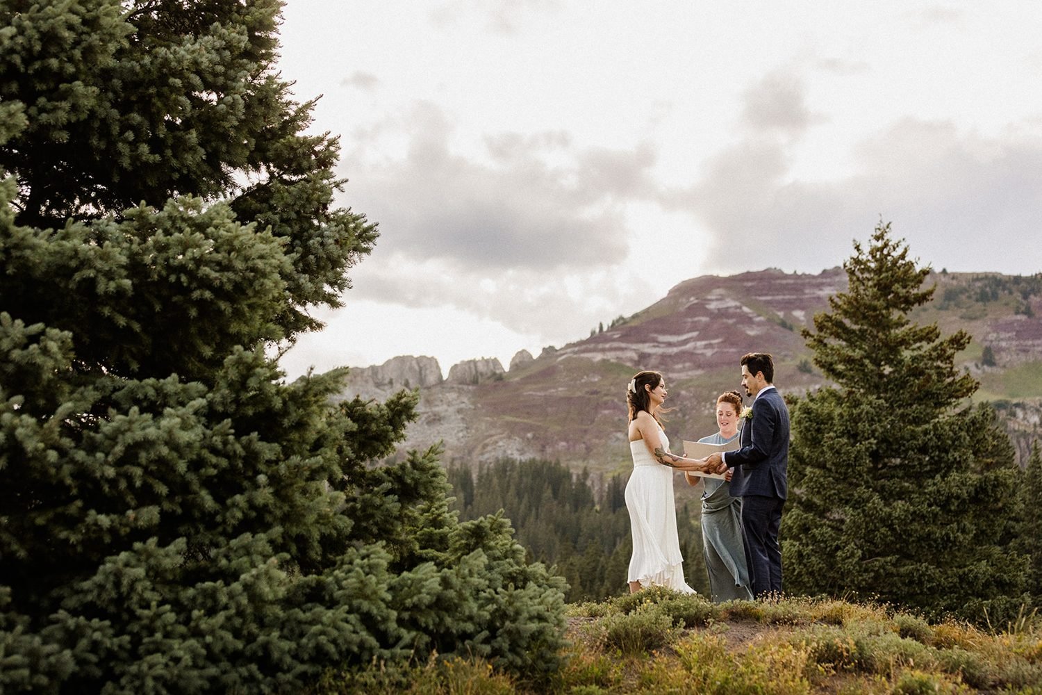 Vows with a mountain backdrop in Crested Butte