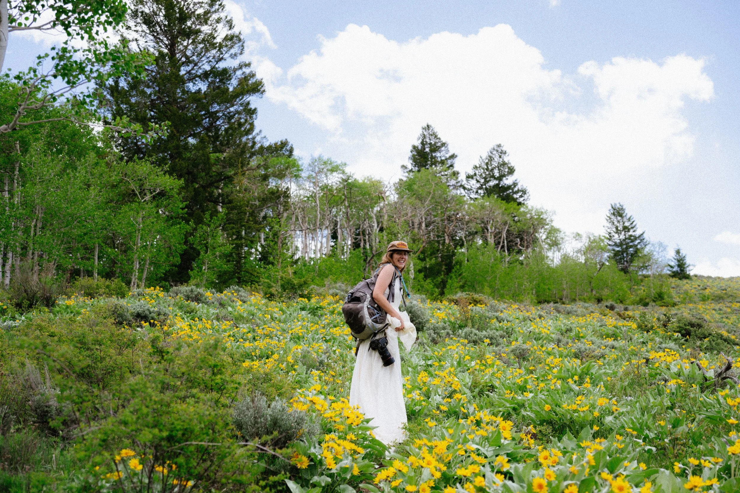 Wedding dress in the back of the car while scouting Colorado elopement locations