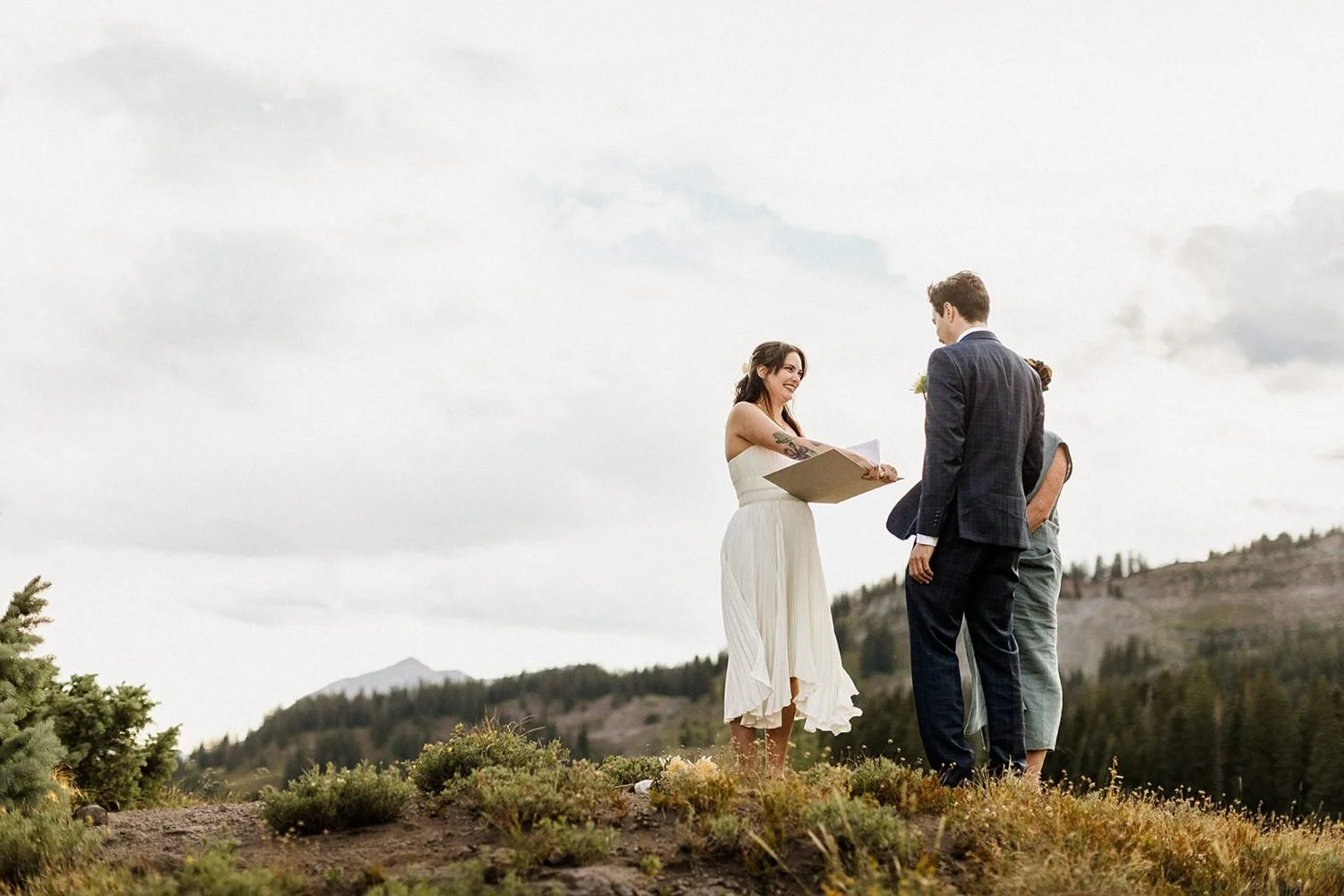 Ceremony on a grassy ridge above Lake Irwin
