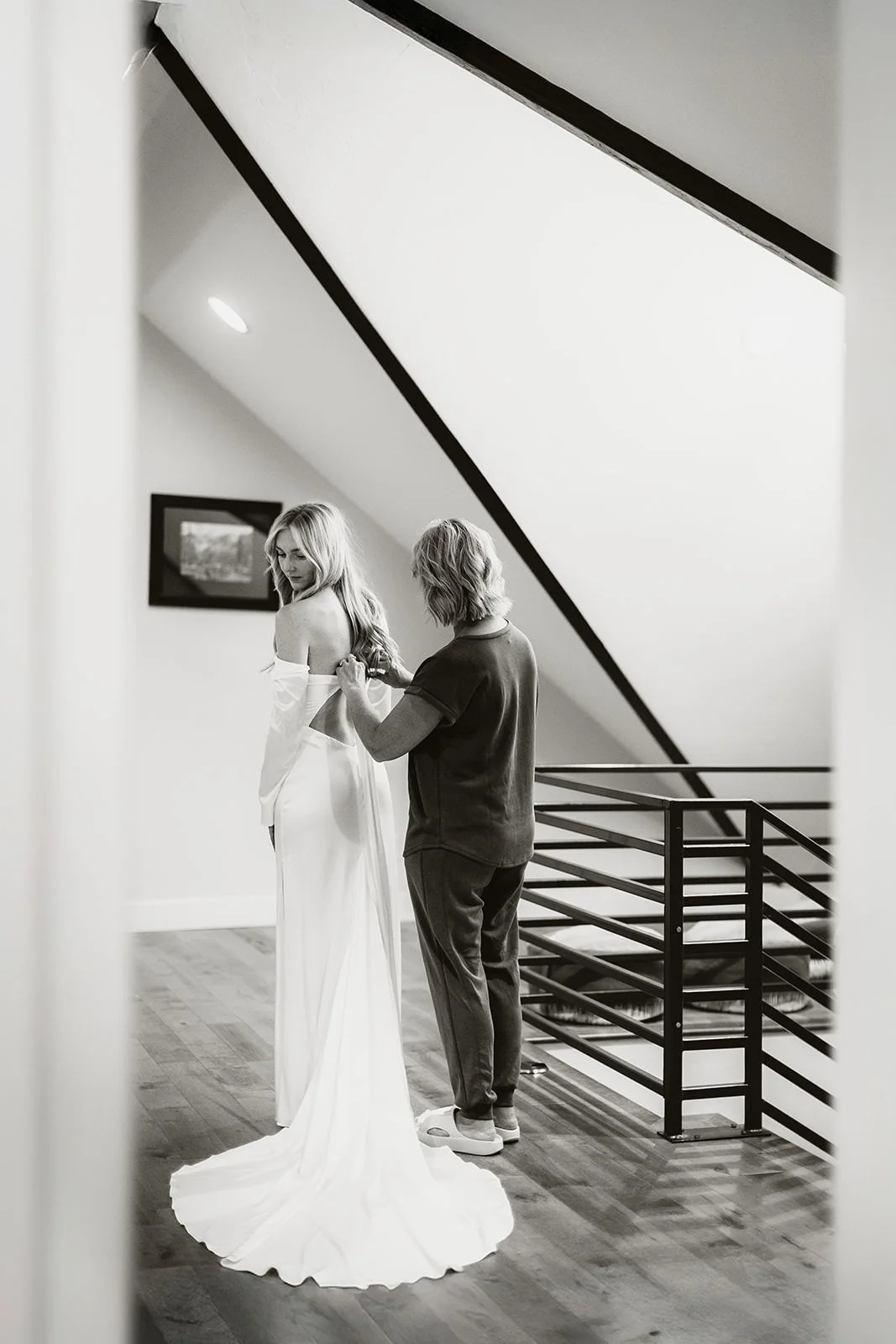 Couple getting ready with family at Airbnb in Crested Butte on their wedding morning