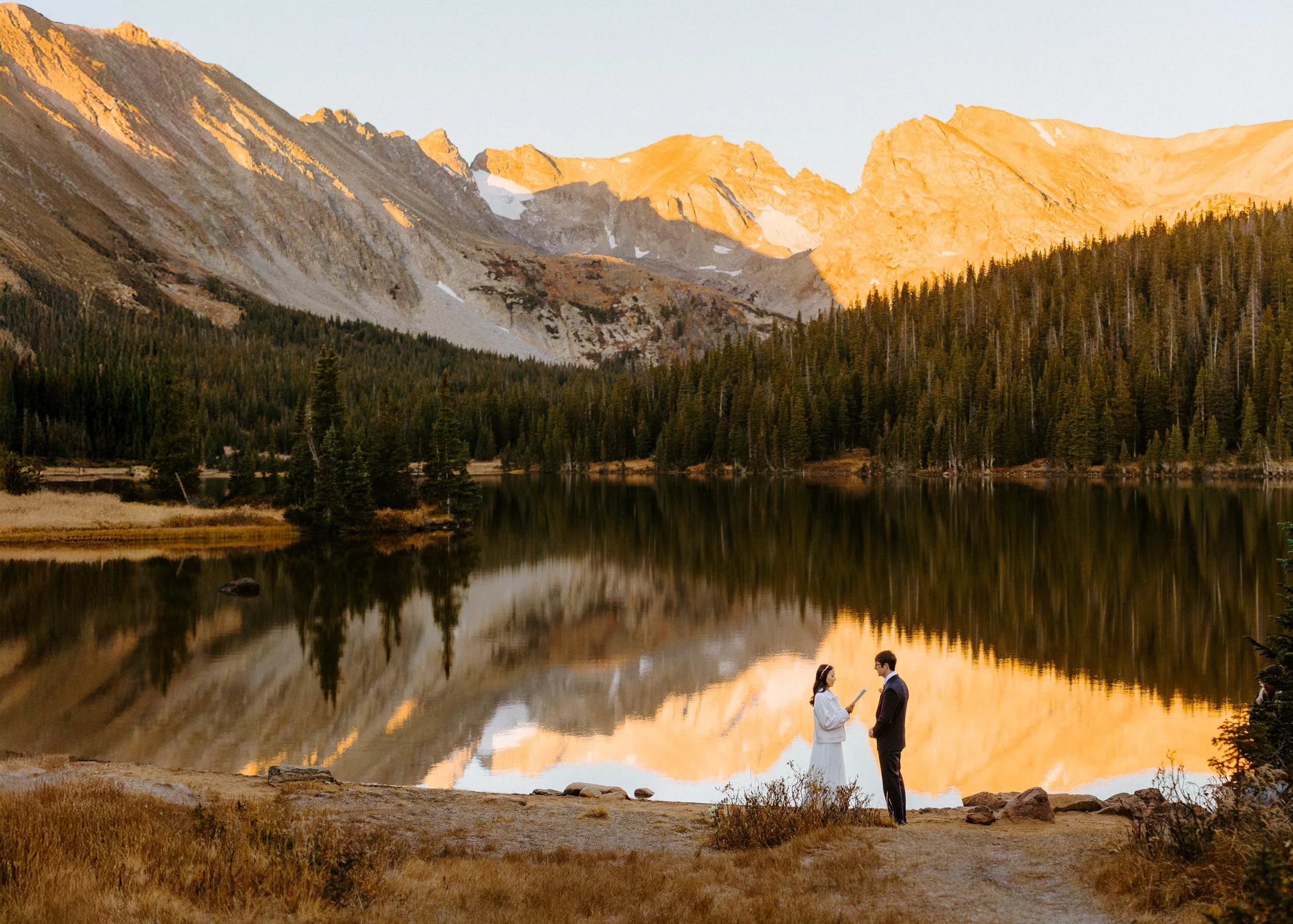 A couple elopes at Brainard Lake Recreation Area in the fall