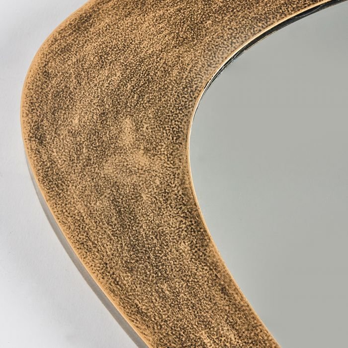 Aluminum mirror frame in an antique brass finish.