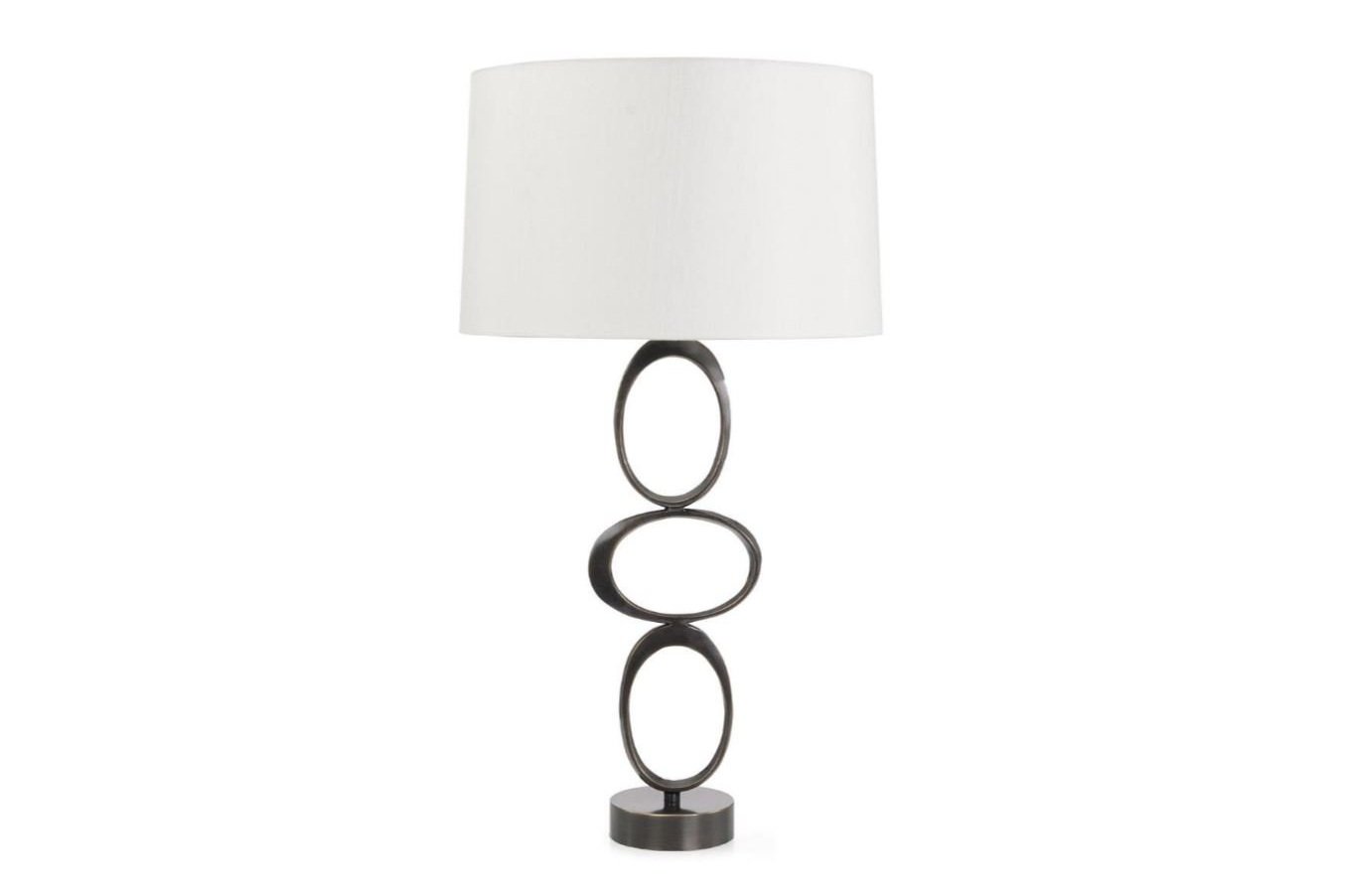 Crafted from metal in a Bronzed finish, the Torc Table Lamp showcases three ovate rings stacked together atop a rounded metal base.
