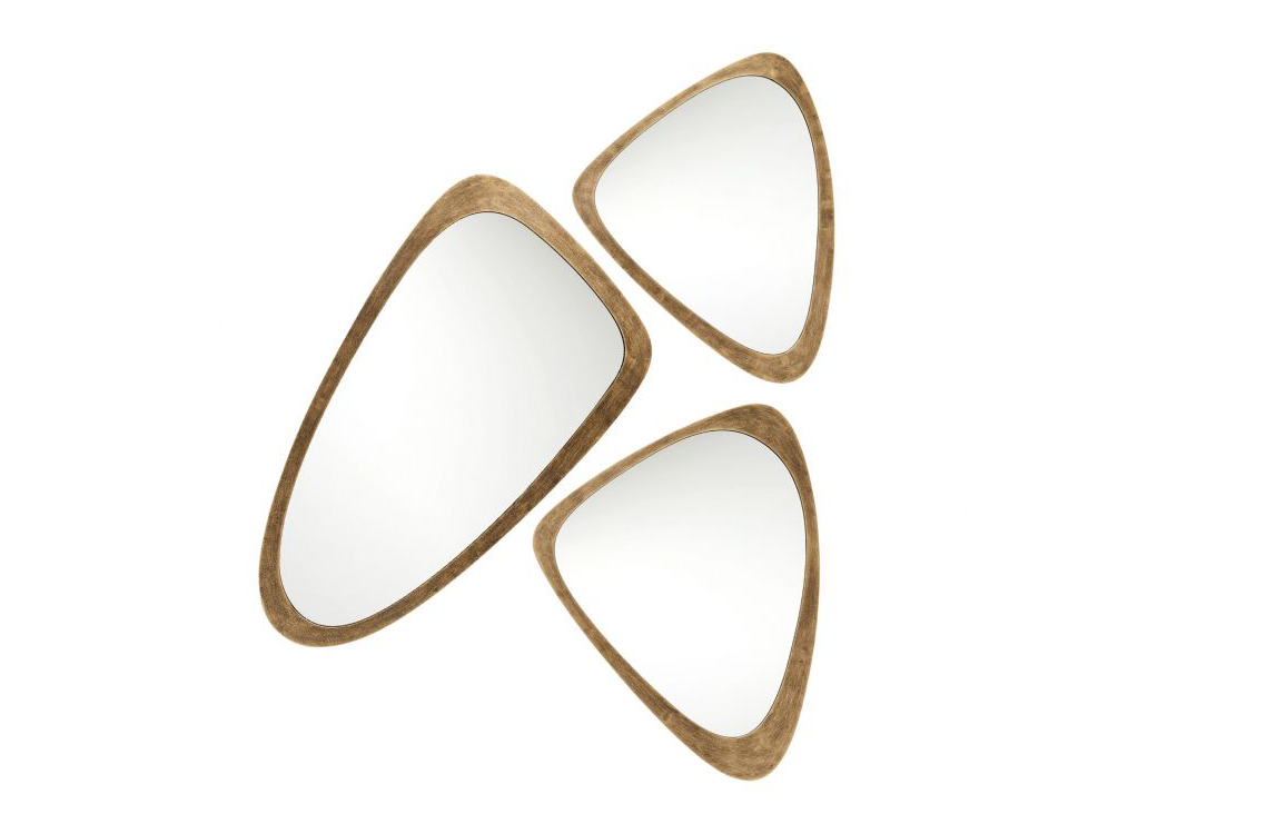 Surprisingly versatile but expectedly stunning, the Wales Mirror Trio presents an organic, midcentury silhouette juxtaposed with an aluminum frame in an antique brass finish.