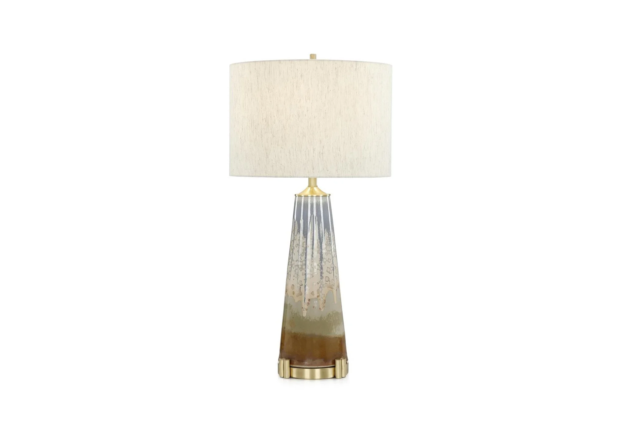 Subtle dripped glazing adds movement and texture, giving the Overflow Table Lamp a fluid, organic character.