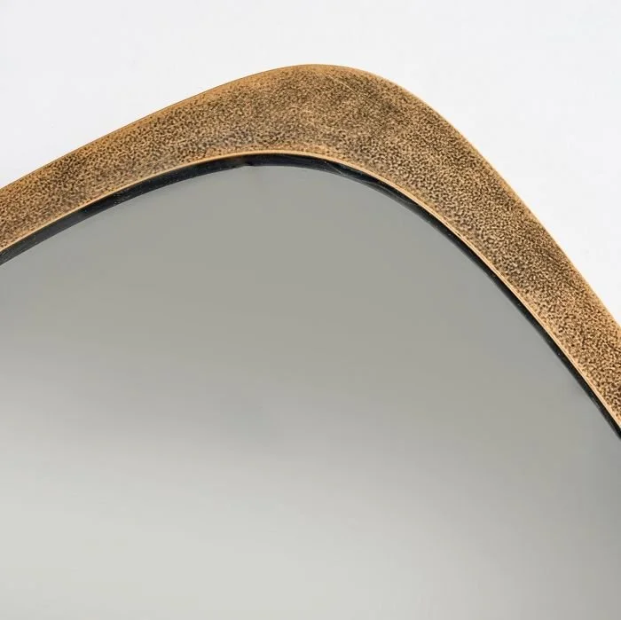 Texture of the aluminum frame surrounding clear mirror.