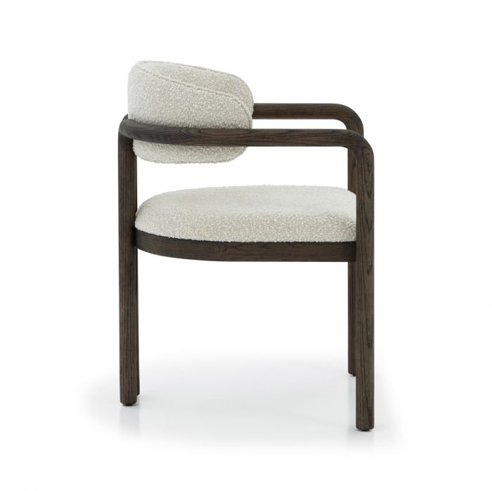 Interlude Home's Fowler Dining Chair showing off it;s wood arm that wraps into the back support beam of the chair.