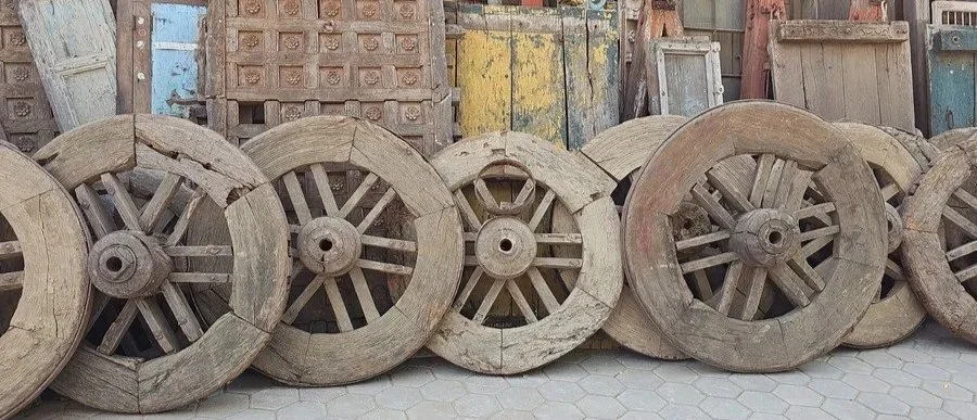 This unique mirror was originally a cartwheel with its spokes removed.