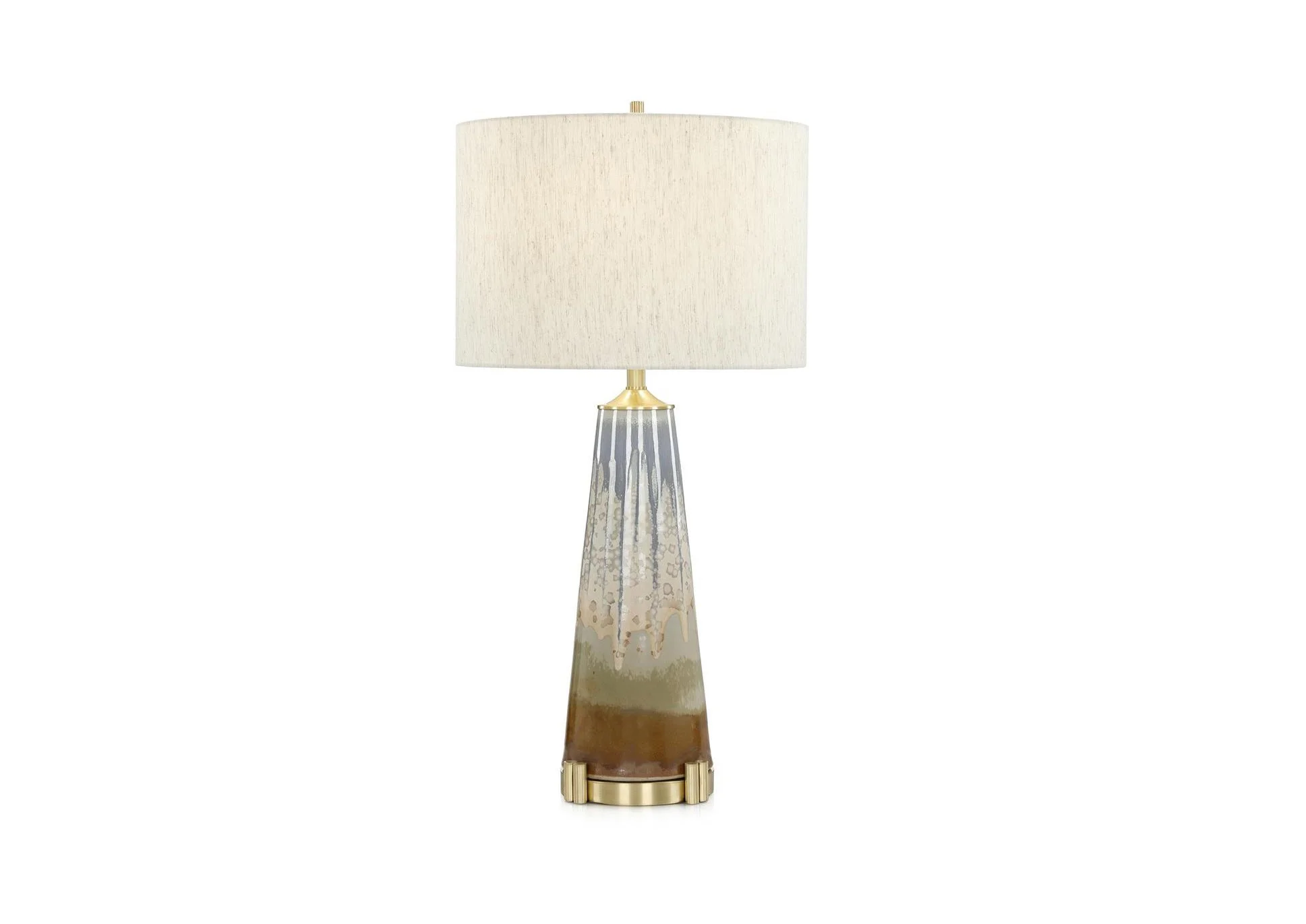 The Overflow Table Lamp is crafted from porcelain, featuring a tapered silhouette adorned with a flowing gradient that shifts from cool blues to warm earthy browns.