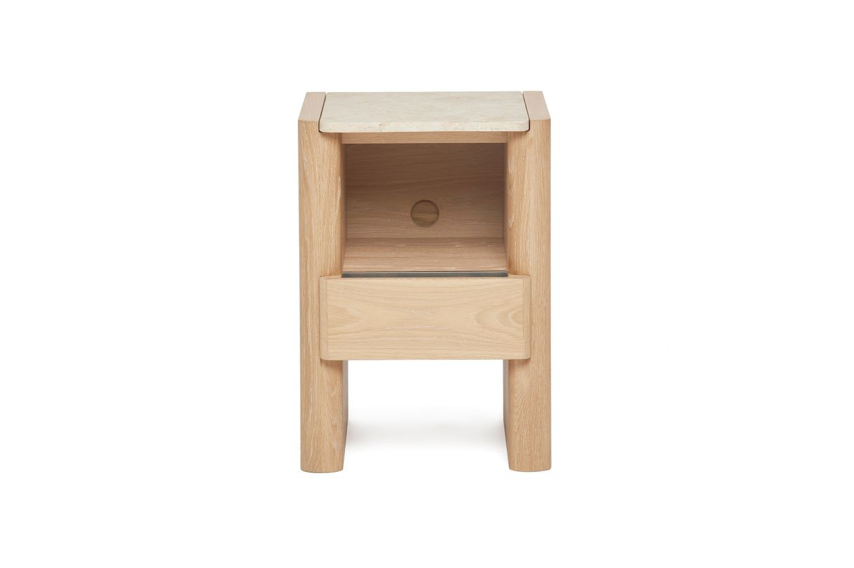 The Arden Small Bedside Chest is crafted of oak in a saddle finish and topped with honey marble.