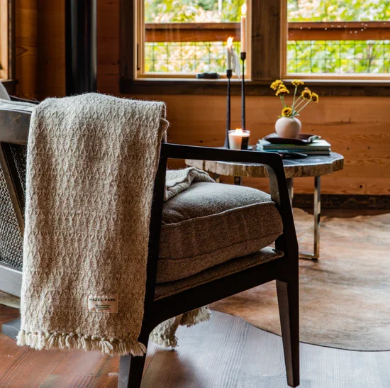 The Handwoven Wool Throw Blanket in Natural Undyed Grey_lifestyle.webp