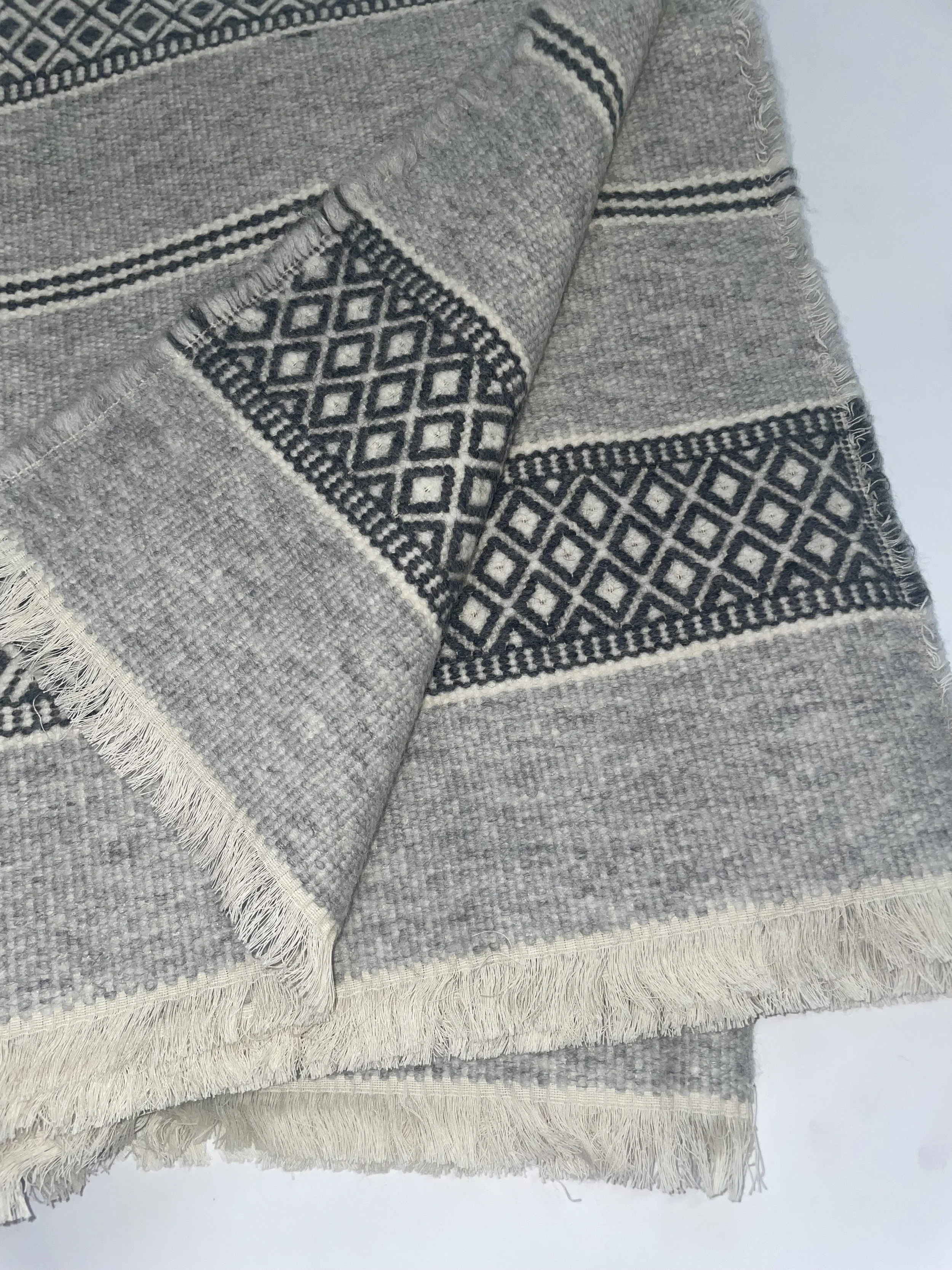 Pipil Throw Blanket fold.jpeg