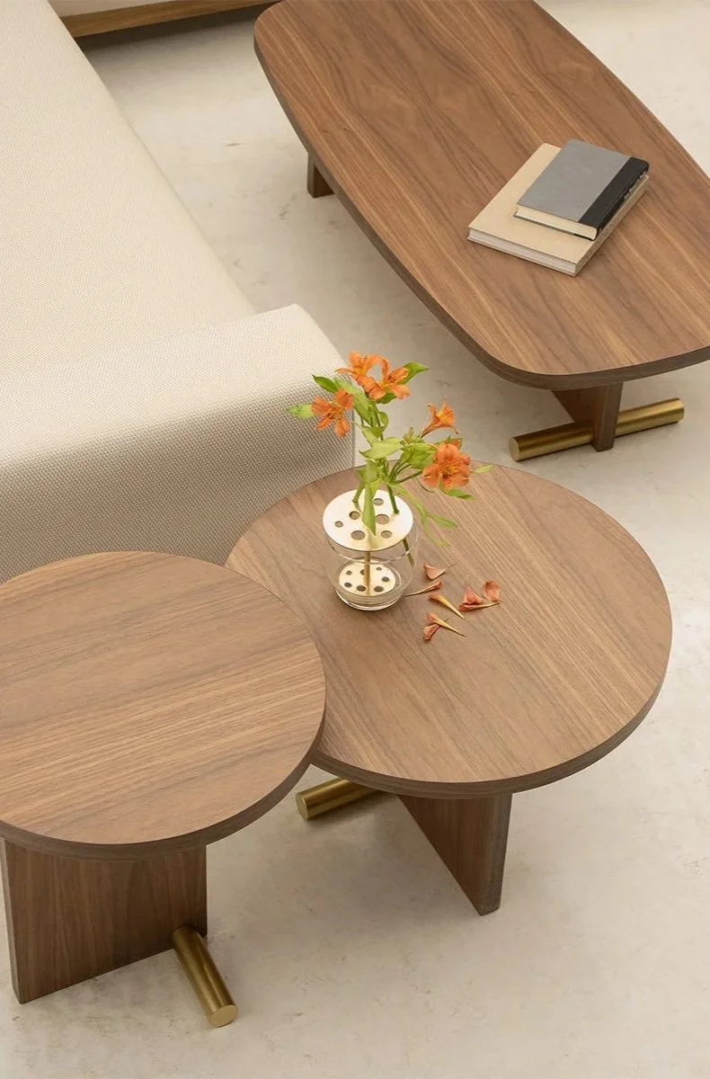 Walnut veneer and Polished Brass accents on the Nova Table.
