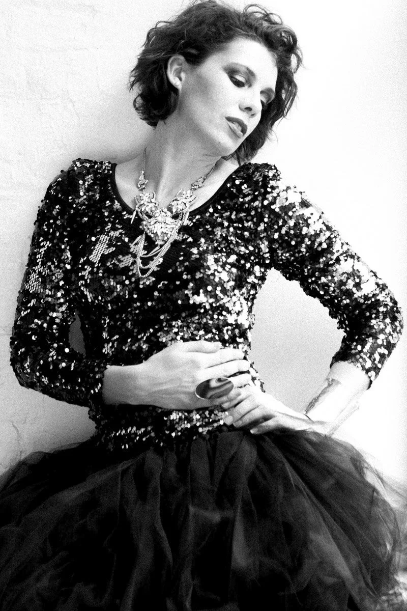 Back and white intimate portrait of a woman wth a sparkly top