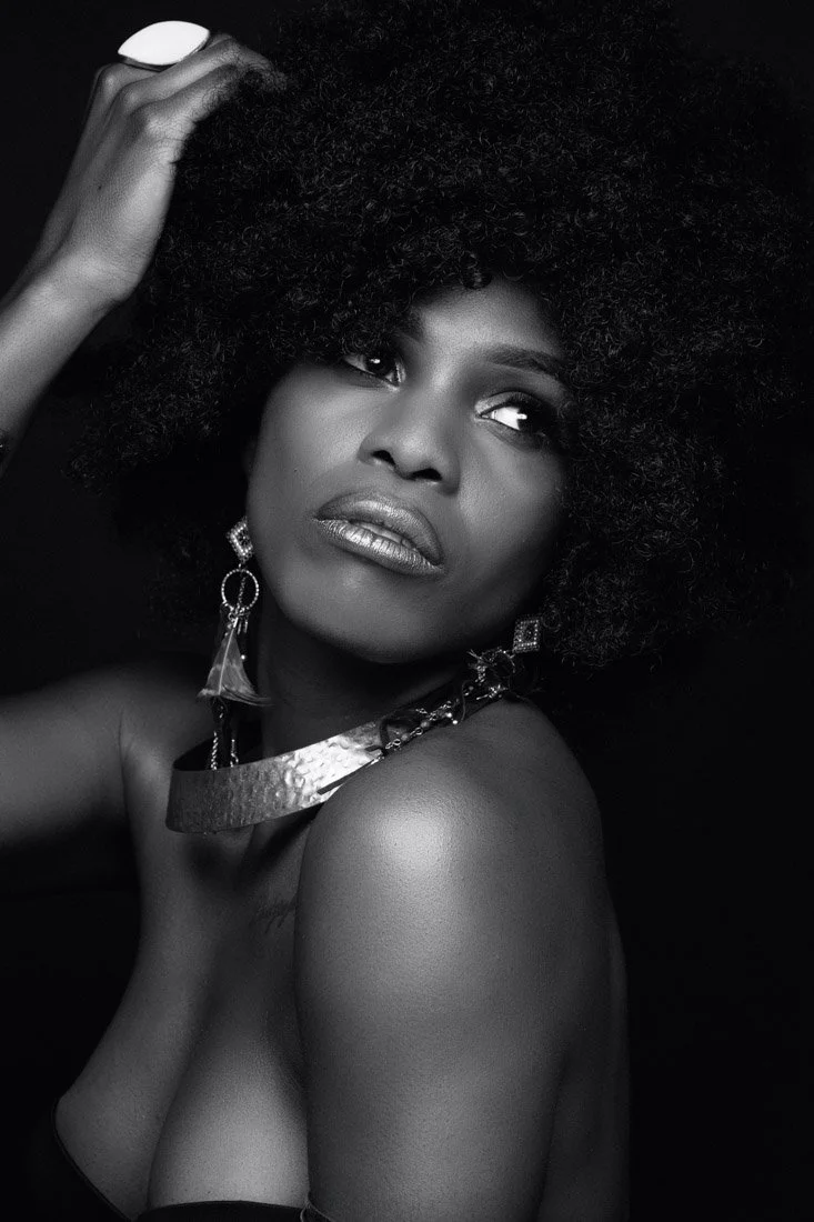 Portrait of a black female with afro hair