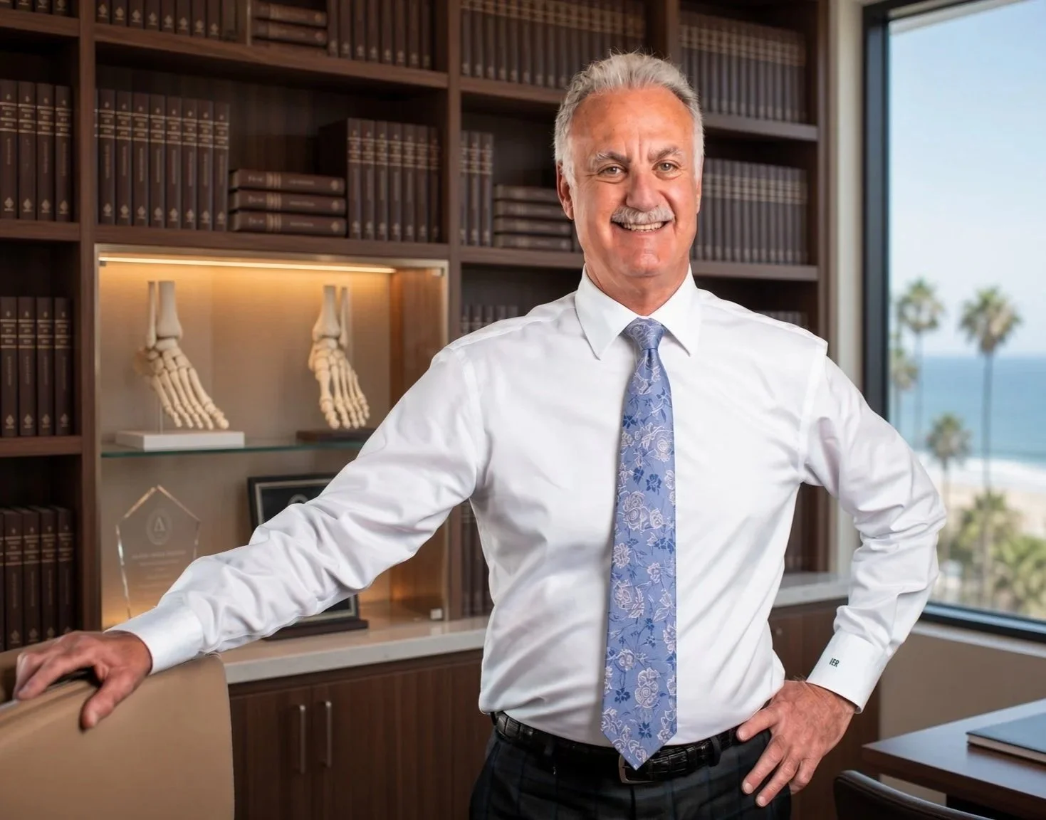 Ivar E. Roth, D.P.M, M.P.H.   Board Certified Foot & Ankle Surgeon, American Board of Foot and Ankle Surgery, standing in his office.