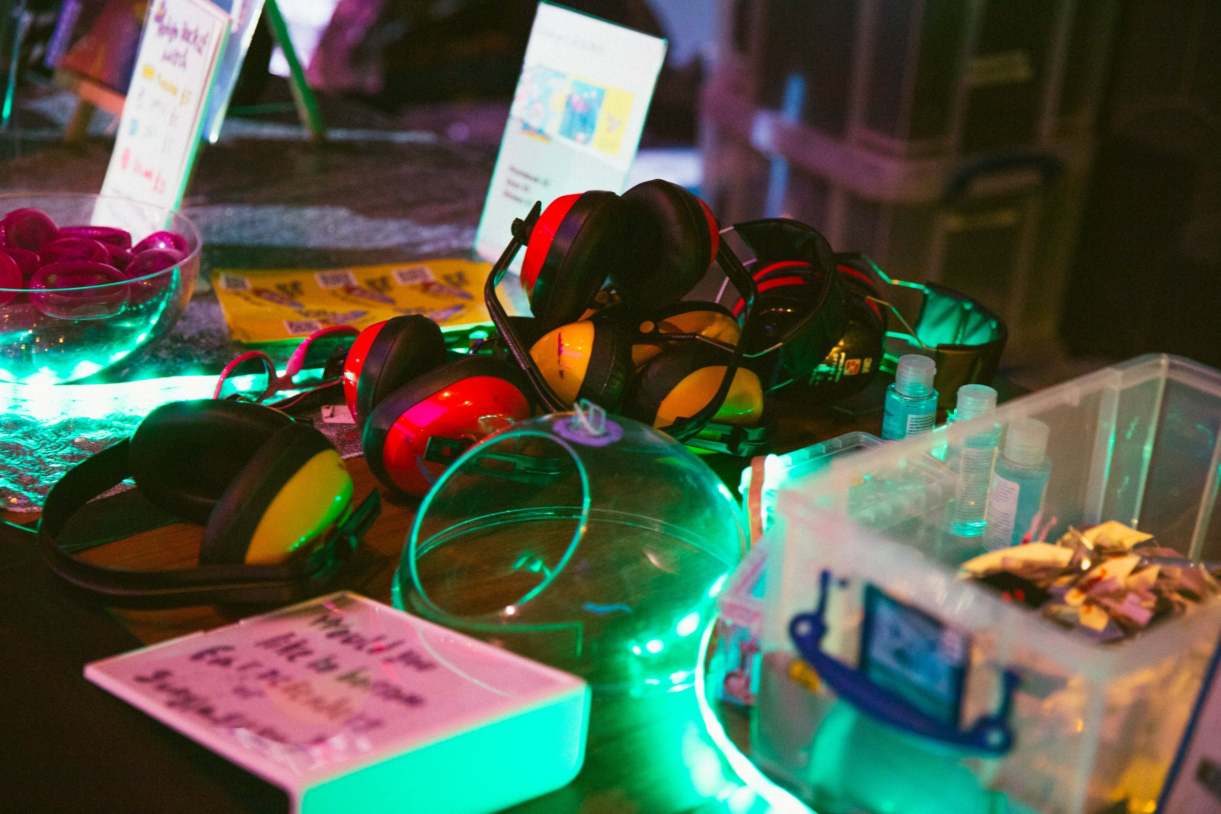 Photo of the merchandise ( merch) and welcome desk , including Ear defenders and Rocket communication badges . Photo by Sian O Connor 