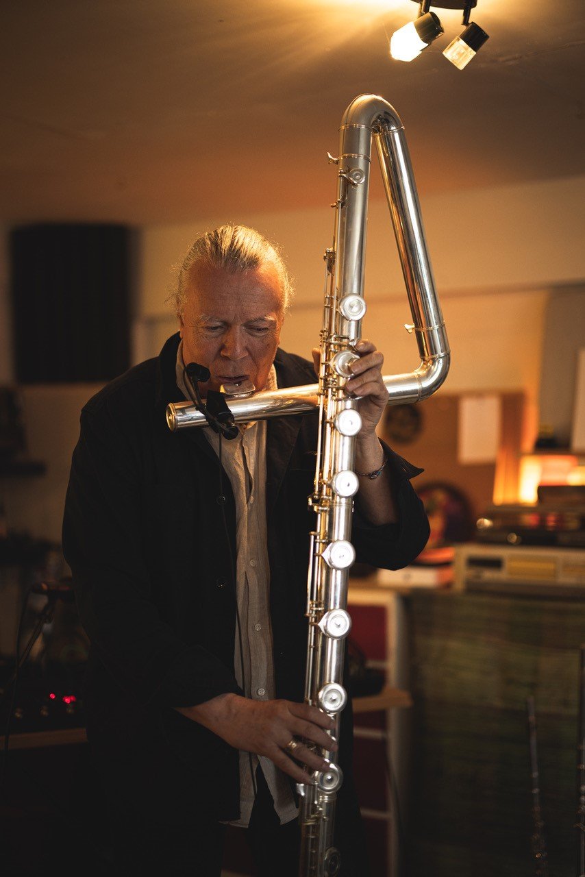 Photo of Patrick shaw Iveersen witha. large flute by Glenn Foster