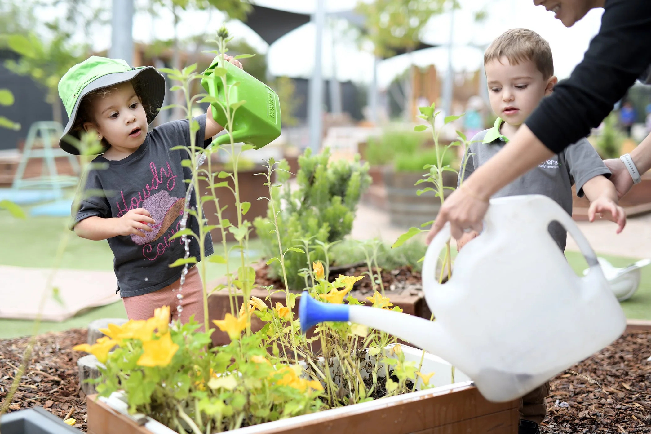 Early Learning Childcare Centres- kids watering the vegetable garden- play centre- kids portraits-.jpg