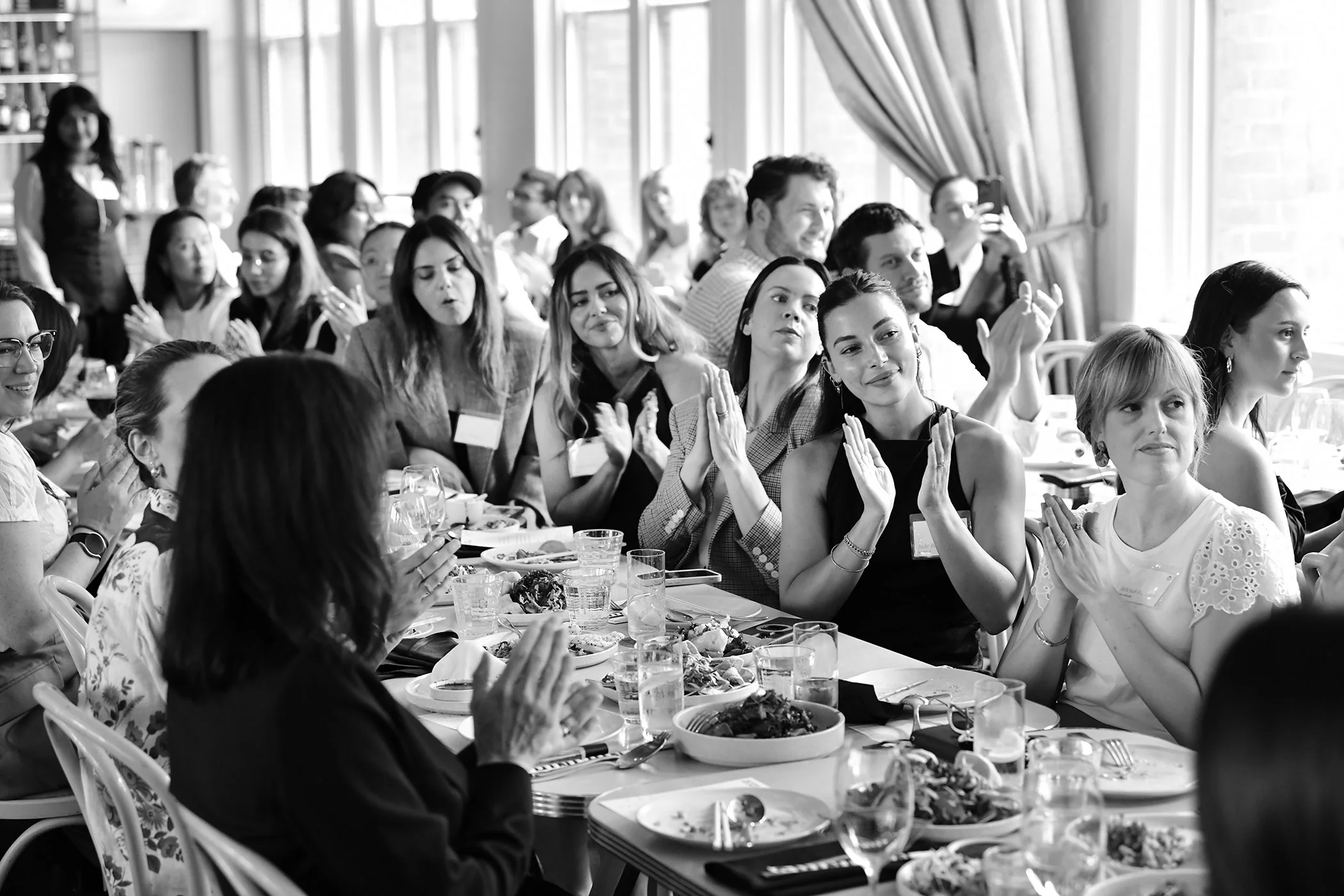 Corporate fund raising event photograph of women sitting at a table by David Fowler.