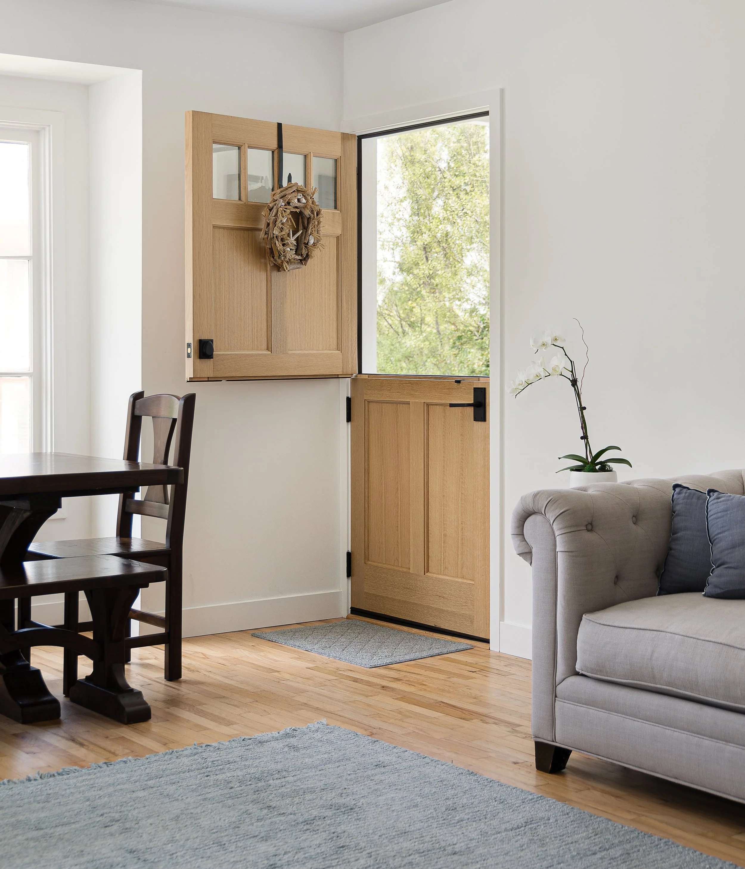 Home entryway with stable door and wreath