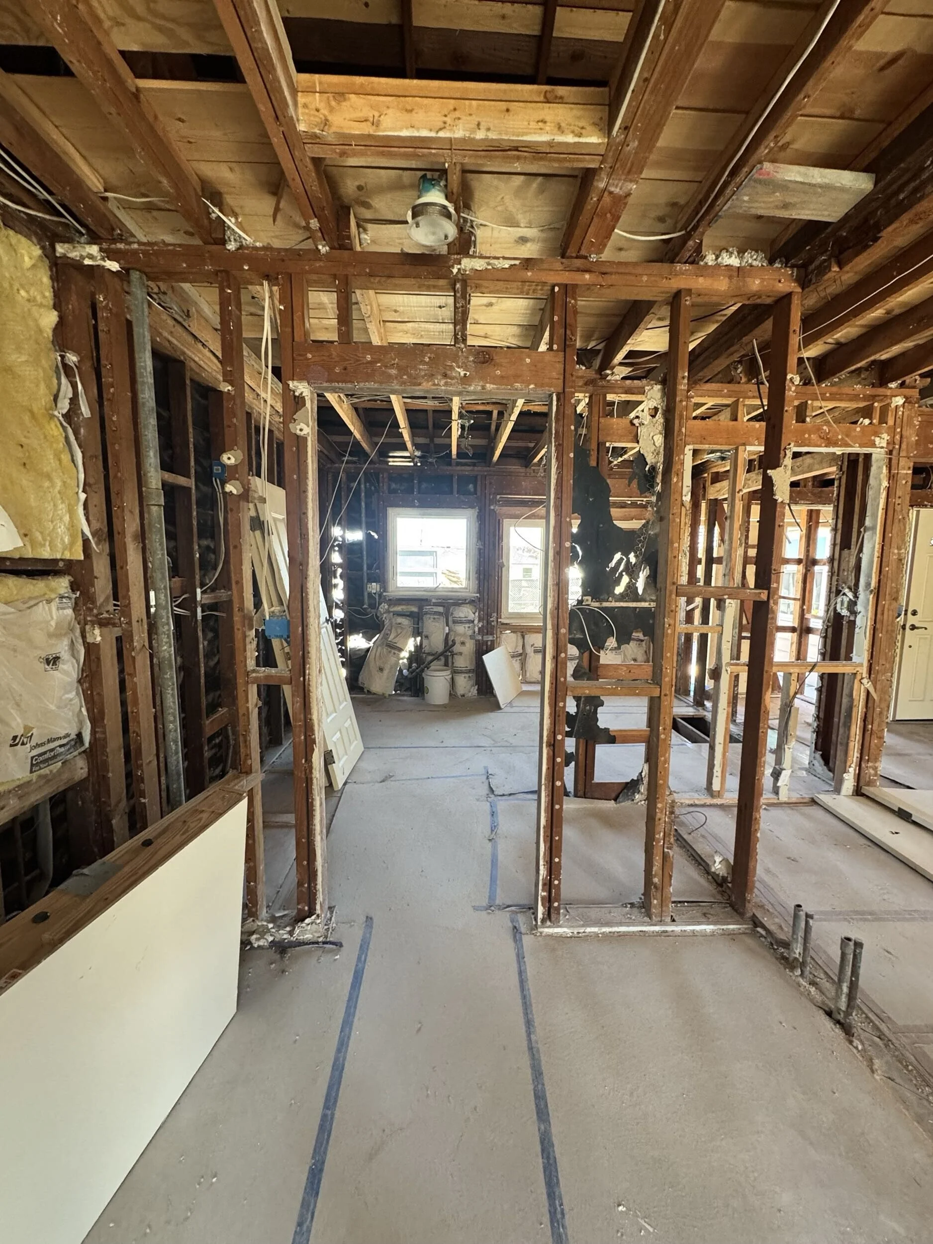 House interior stripped down to wooden beams