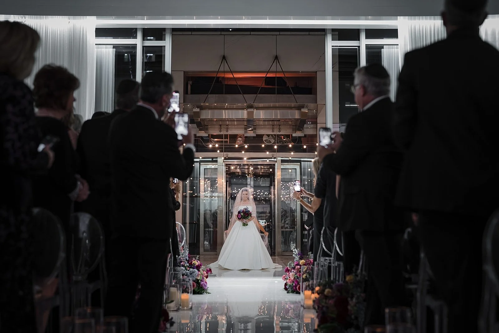 bride preparing to walk down the isle wedding at Joule Hotel Downtown Dallas