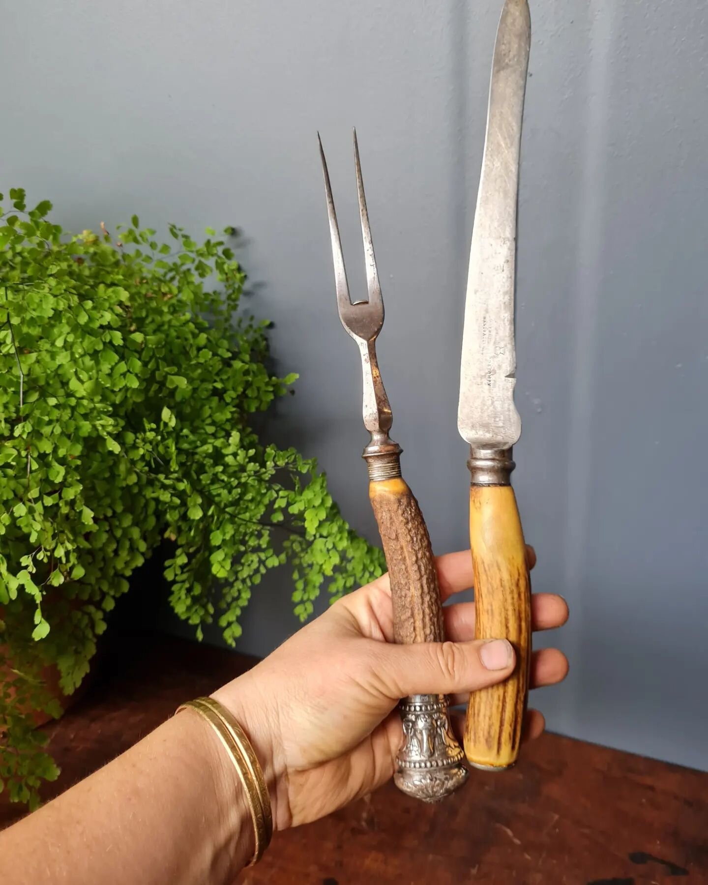 Pair of 19th Century Stag antler carving knife &amp; fork.&nbsp; These are not originally a pair but work well together.&nbsp; &nbsp;Fabulous Sterling silver mounts with Ram's head decoration to the fork.&nbsp; It is&nbsp; hallmarked but some of the 