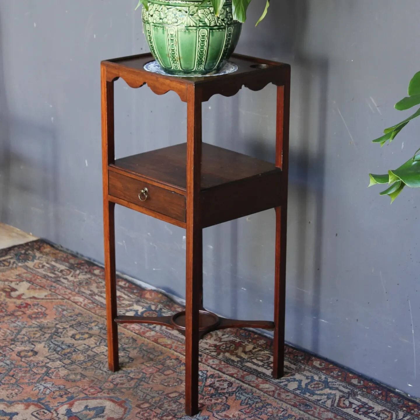 Small Edwardian Mahogany wash stand,&nbsp; makes a great plant stand.&nbsp; Centre hole for a wash bowl and two smaller ones for soap &amp; brush holders.&nbsp;
A plate works to support a pot if you used it for a plant stand.&nbsp; A small repair to 