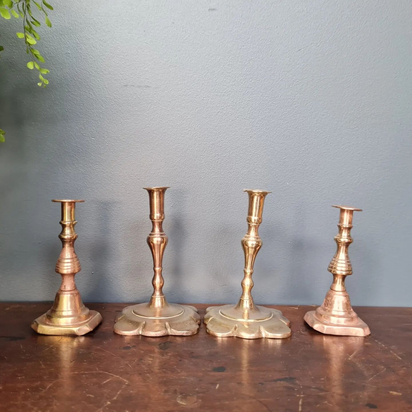 Two pairs&nbsp; of&nbsp; small brass candlesticks.&nbsp; The taller ones are very solid &amp; well shaped, the smaller ones are 19th C and have some dents to the base.&nbsp; will hold smaller candles.&nbsp; The taller&nbsp; are 110mm high, the shorte