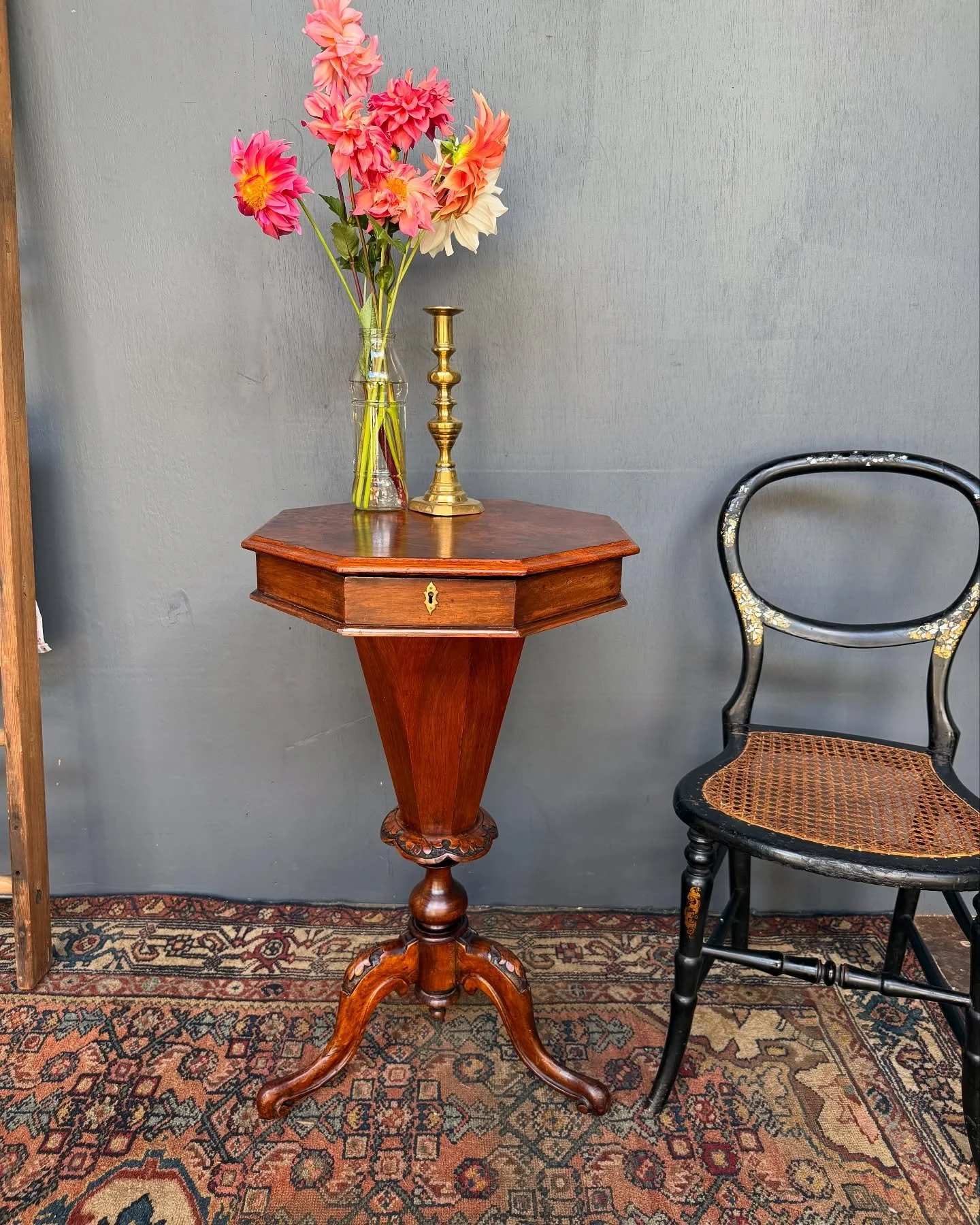 Victorian trumpet sewing table, Walnut with burl Walnut veneer to the top and  carved details to the base and legs. 
The inside is stunning with lining of pink and gold paper.  The perfect jewelry or sewing box. 
The top has bowed a little over the y