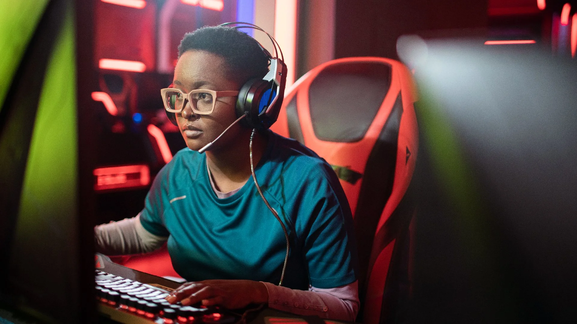gamer woman at computer with headset on