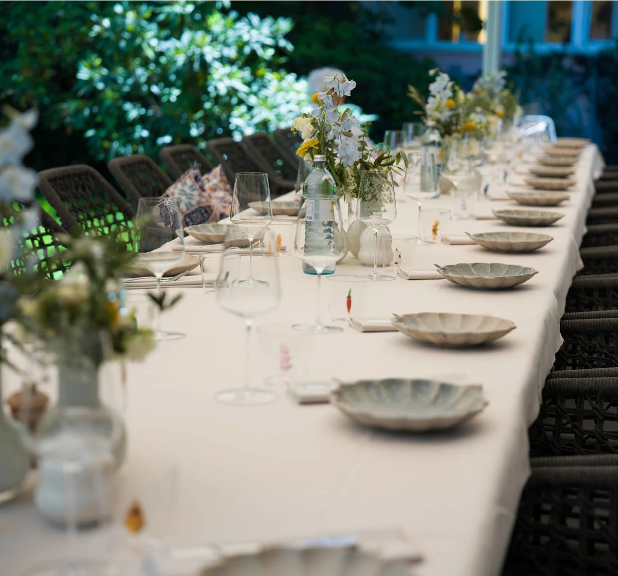 Elegantly set table in the garden at ANIMO by Aigner for a wedding, christening or anniversary celebration in Salzburg
