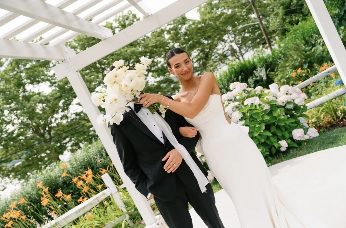 bride and groom posing for wedding photographer in NYC