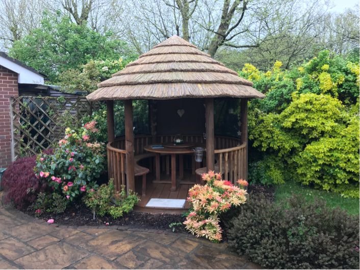 10 year old Chiltern Garden Building After Re-thatching.jpg