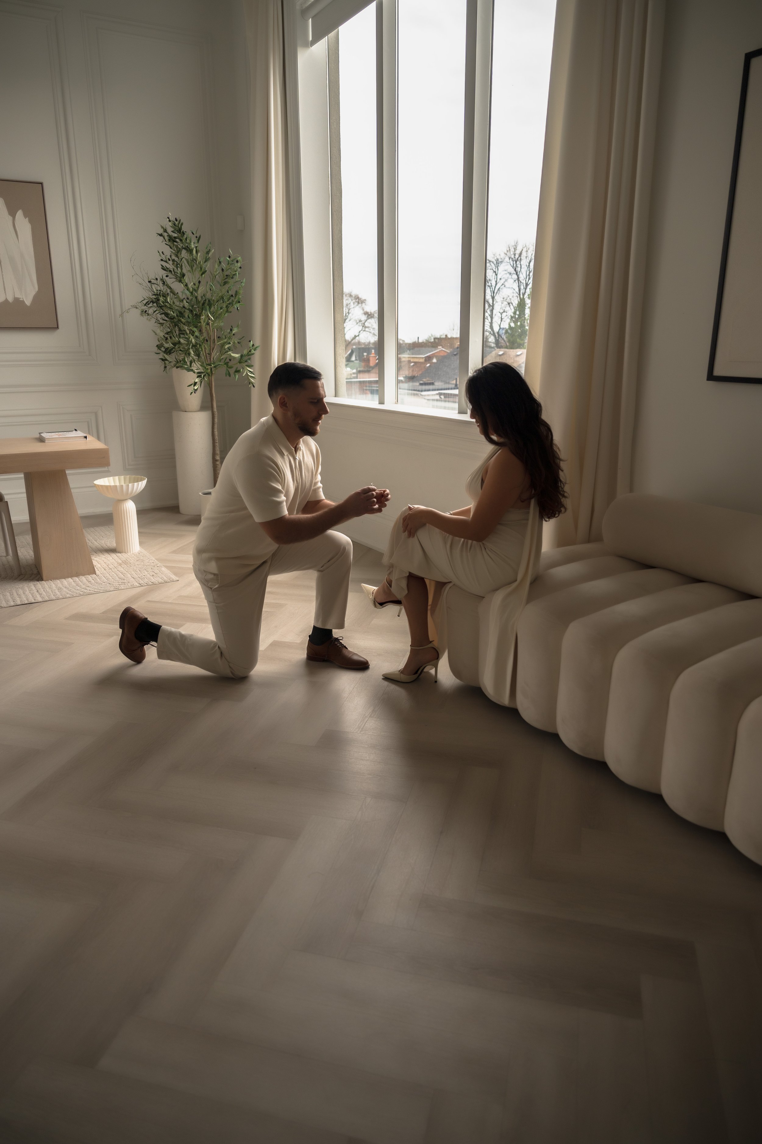 Gentleman proposing to a young lady in a nice room