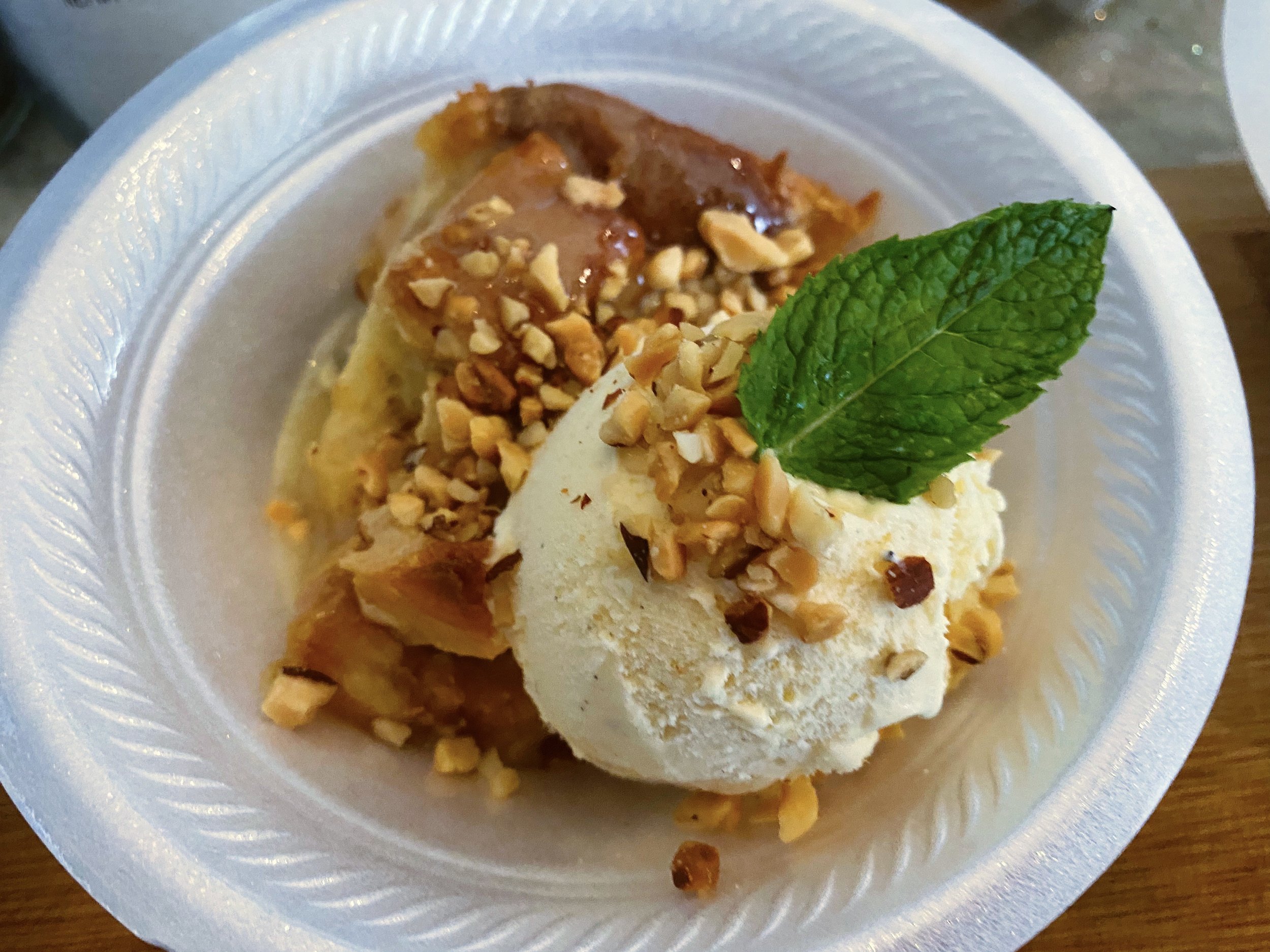 Bread Pudding Ultimate with Sweet Bourbon Sauce and French Vanilla Ice Cream Topped with Dessert Nuts!