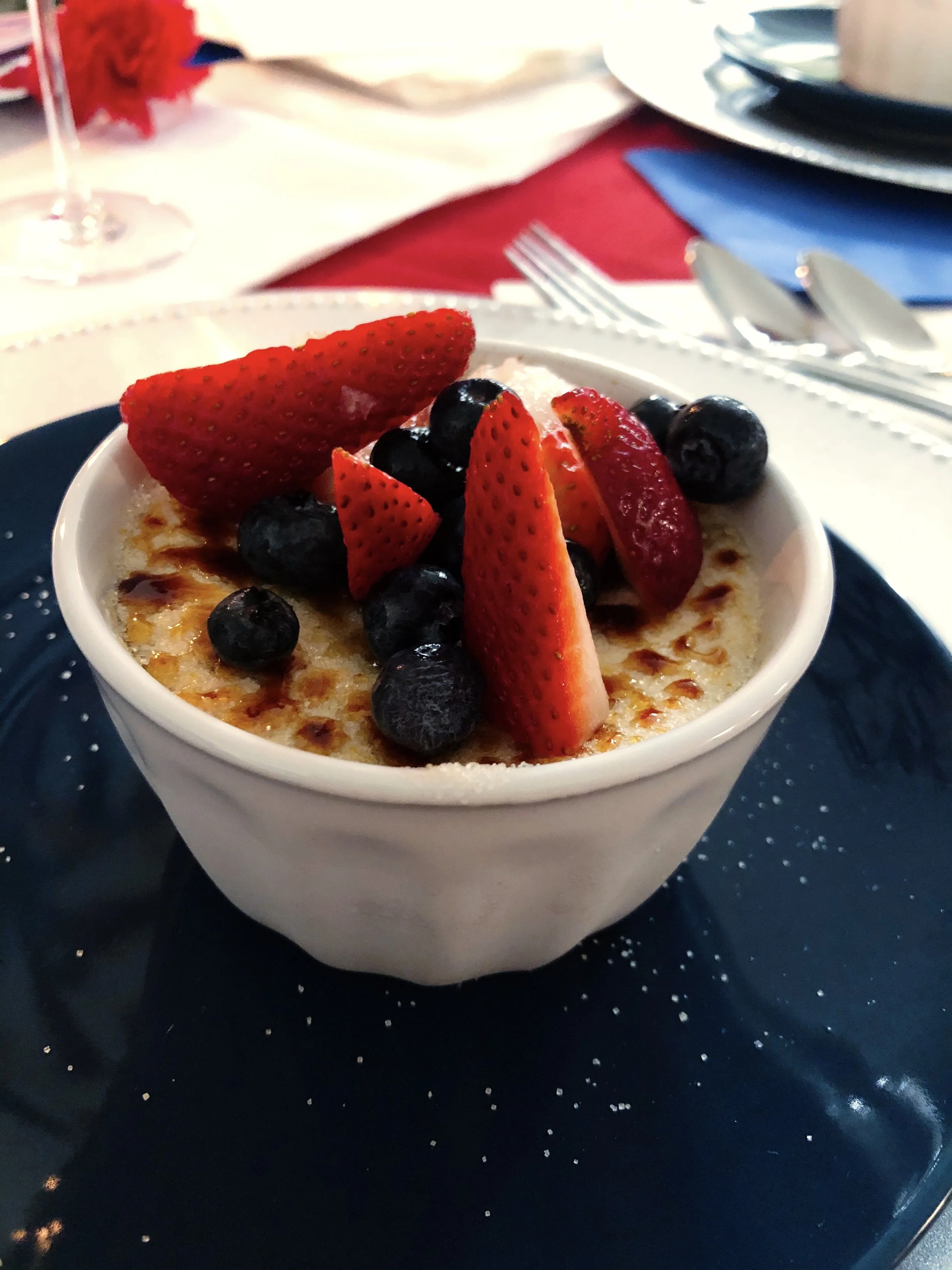 Crème Brȗlée topped with mixed berries
