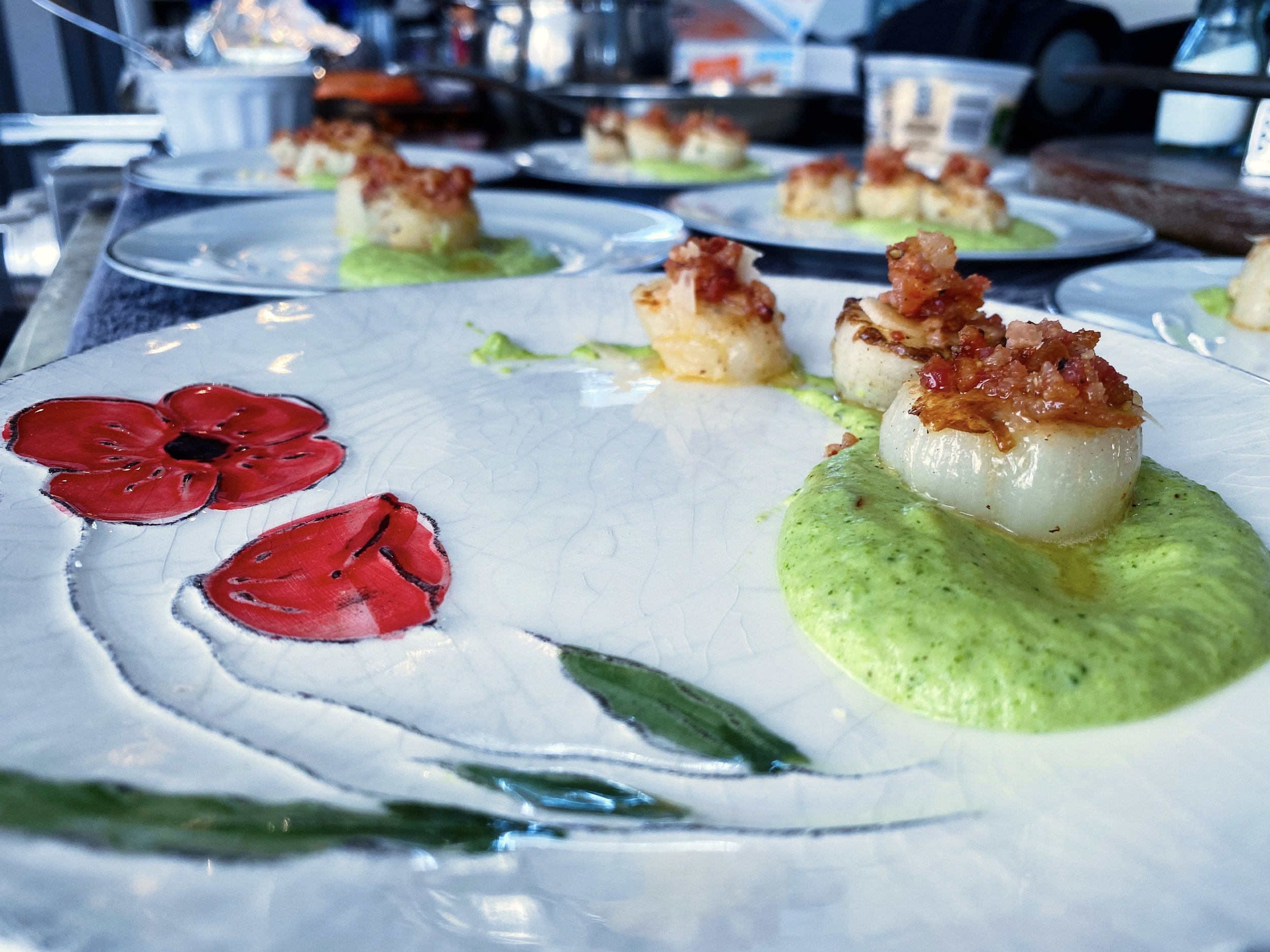 Seared Scallops with Broccoli Couli Topped with Parmesan and Bacon Bits