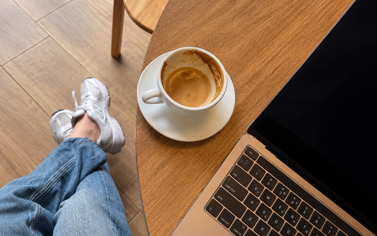"High-achieving woman looking drained at her desk — what long-term burnout looks like for successful women in midlife"