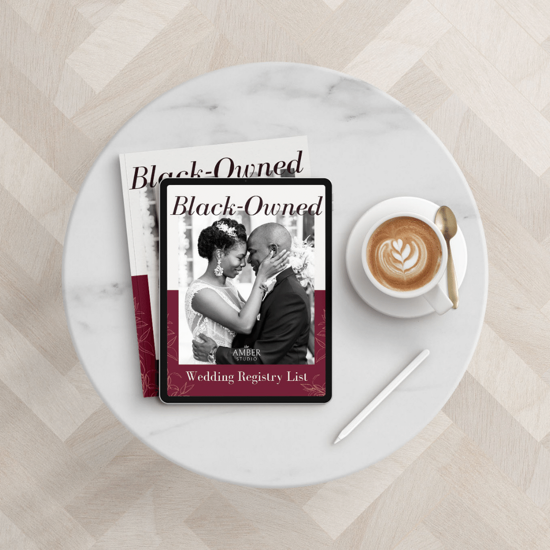 A round marble table with an iPad displaying a Black-Owned Wedding Registry List and a cup of coffee