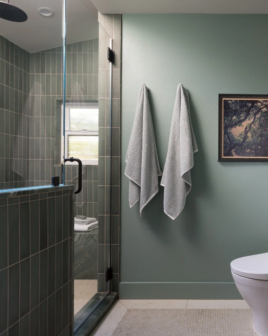 Earthy tones, timeless calm 

This primary bathroom blends soft beige with rich green tiles to create a space that feels both grounded and refreshing. The natural palette brings warmth, while the contrast adds just the right amount of depth and chara