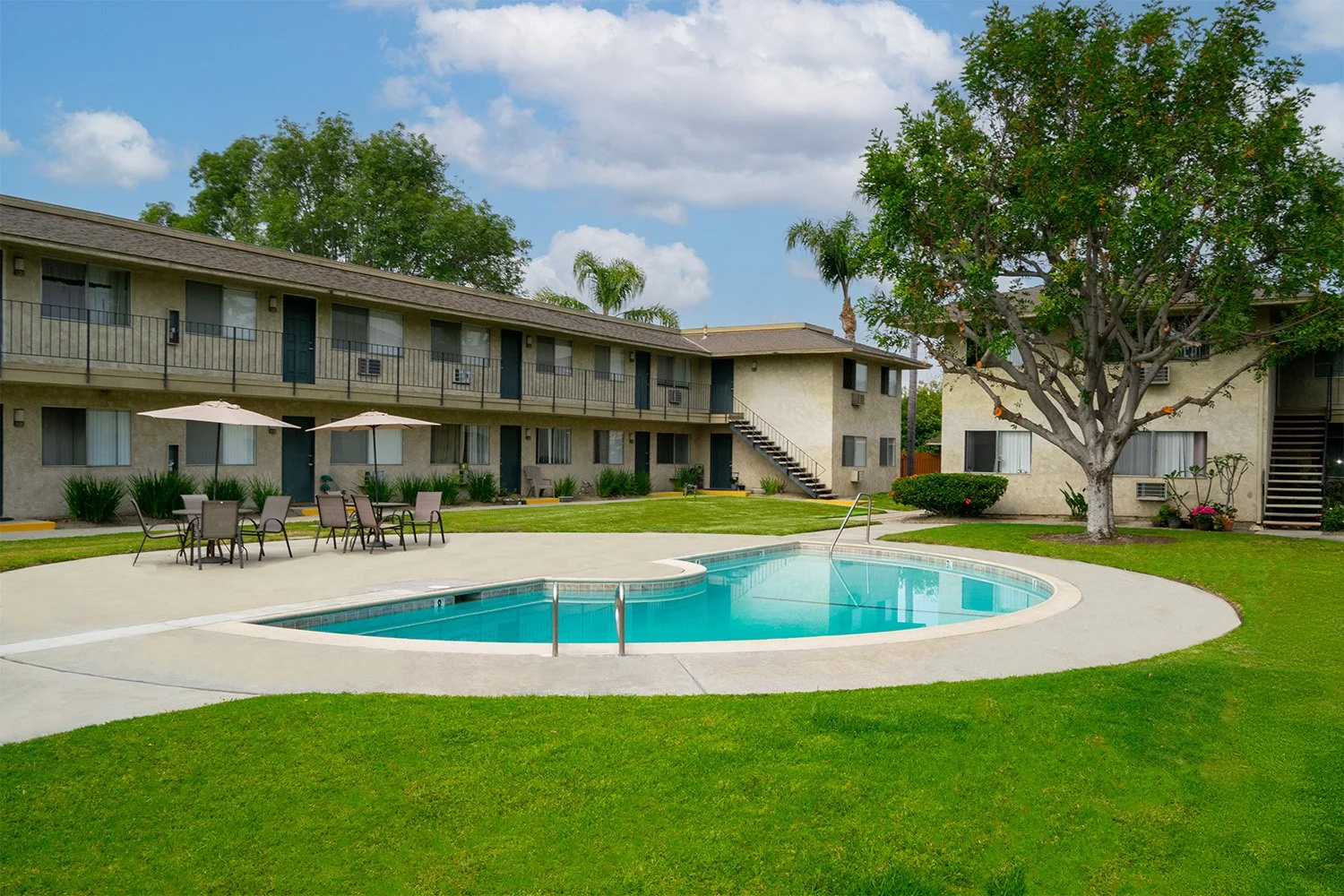 The sparkling swimming pool at Rancho Del Monte surrounded my beautiful landscaping