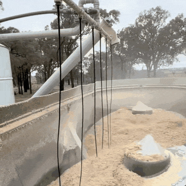 Molasses pours evenly into mixer through dribble bar