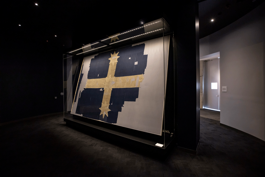 Southern Cross Flag in dark room.