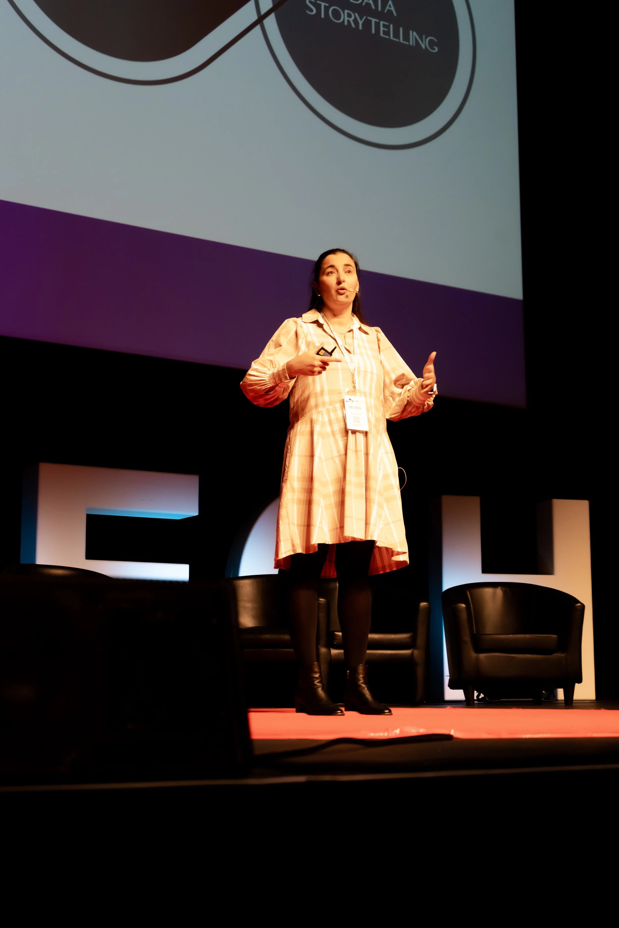 Selena presenting a keynote on data storytelling at a national conference