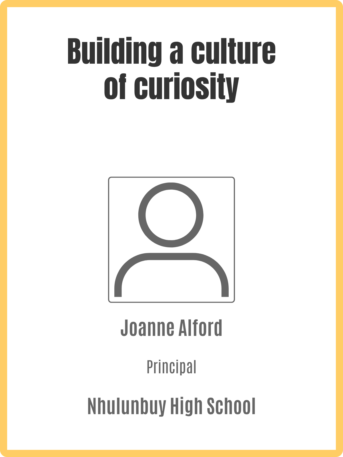 Front of a black and yellow sign with the message 'Building a culture of curiosity' and a gray outline of a person icon. The sign includes the name 'Joanne Alford' and the school 'Nnulunbuy High School' at the bottom.